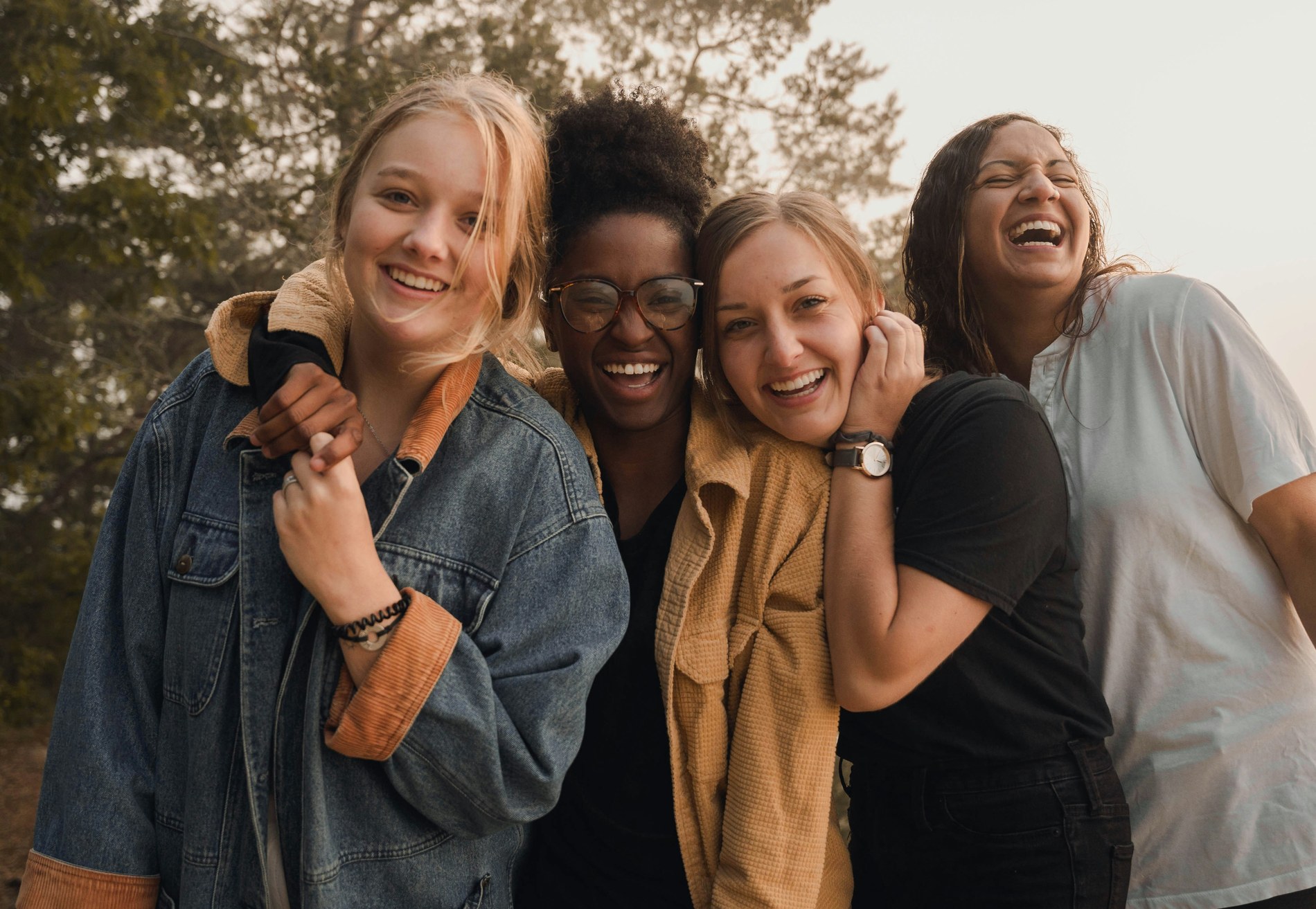 Young women laughing together outdoors, representing Brown Rice's advocacy community